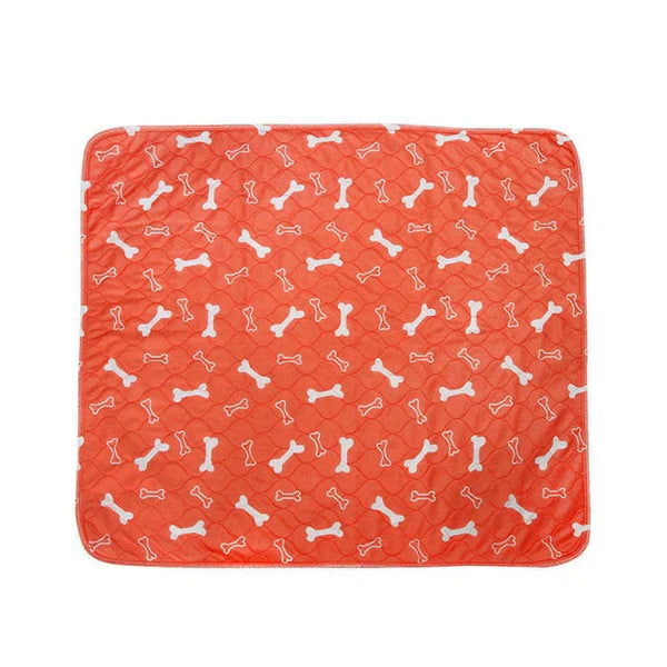Oranje hondenmat met witte botjesprint, waterdicht en duurzaam, ideaal voor huisdieren. Perfect voor hondenmanden of vloeren.