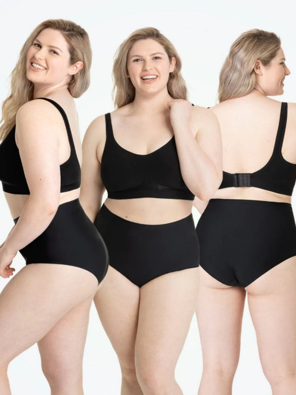 Drie vrouwen in zwarte shapewear set, voor- en achterkant zichtbaar. Comfortabele, naadloze lingerie voor plus-size dames.