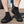 Zwarte unisex waterschoenen met sokachtige pasvorm, antislip zool en ademend materiaal, ideaal voor outdoor activiteiten en watersport.