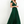 Vrouw in elegante groene avondjurk met diepe V-hals en korte mouwen, staand tegen een witte achtergrond. Perfect voor formele gelegenheden.