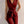 Rode mouwloze jumpsuit met V-hals en strikceintuur, elegante damesmode, perfect voor avondkleding of zakelijke evenementen.