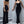 Zwarte jumpsuit dames, mouwloos met wijde pijpen, elegante avondkleding, minimalistisch ontwerp, geschikt voor formele gelegenheden.
