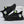 Zwarte sportschoenen met groene accenten, ademend mesh, lichtgewicht zool, geschikt voor hardlopen en fitness. Trendy en comfortabel schoeisel.