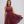Vrouw in elegante bordeauxrode kanten jurk met halternek en wijde rok, perfect voor avondfeesten. Stijlvolle mode, dameskleding, feestjurk.