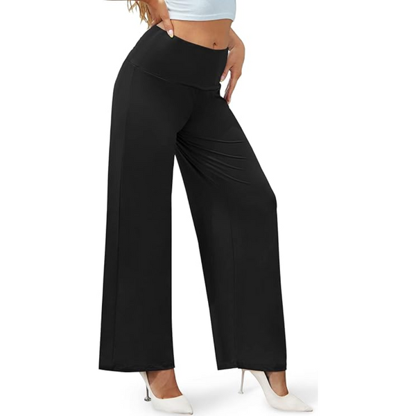 Vrouw draagt zwarte wijde broek met hoge taille en witte hakken, modieuze dameskleding, comfortabele pasvorm, geschikt voor casual en formele gelegenheden.