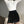 Witte coltrui met zwarte hoge taille fluwelen shorts, modieuze dameskleding, minimalistisch design, trendy outfit voor herfst en winter.