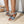 Dames sleehaksandalen met zilveren gesp, blauwe slangenprint en witte zool, perfect voor zomermode en casual outfits.