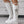 Witte hoge laarzen met veters en sterdecoratie, trendy damesmode, stijlvolle schoenen, perfect voor casual en feestelijke outfits.