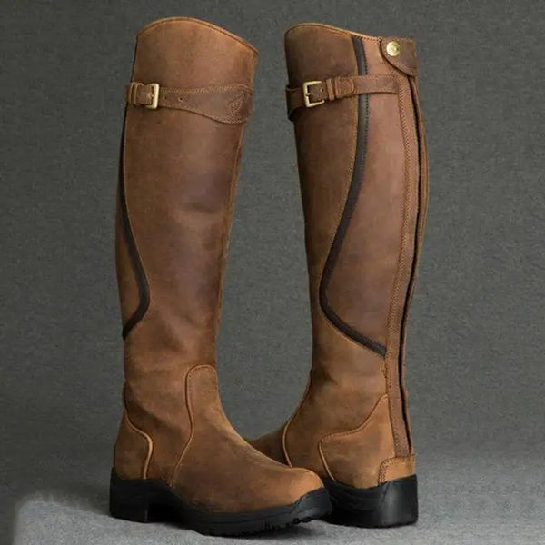 Bruine dameslaarzen van PU-leer met ritssluiting, retro stijl, lage hak, gladiator design. Modieuze en comfortabele laarzen voor dagelijks gebruik.