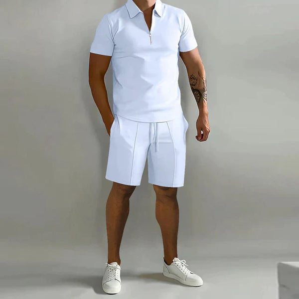 Heren zomer trainingspak, witte polo en korte broek, sportief en casual, perfect voor warme dagen, comfortabele pasvorm, modieuze herenkleding.