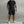 Zwarte heren poloshirt en korte broek set, sportief en casual, ideaal voor zomertraining. Comfortabele pasvorm, korte mouwen, met rits.