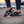 Zwarte sandalen voor dames op een strand bij zonsondergang, comfortabele wandelschoenen, ideaal voor zomerse avonturen en casual outfits.