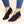 Zwarte Alamea V-cut enkellaarsjes met ritssluiting, lage hak en contrasterende stiksels, gedragen met blauwe jeans. Trendy damesmode schoeisel.