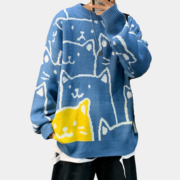 Blauwe trui met kattenprint, unisex design, gele kat accent, casual mode, comfortabele pasvorm, trendy herenkleding, streetwear stijl.