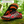 Rode barefoot schoenen met zwarte en oranje zool, ontworpen voor flexibiliteit en comfort, ideaal voor wandelen in de natuur.