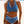Vrouw in blauwe bikini met witte zigzagdetails op strand. Haltertop en high-waist slip. Zomermode, strandkleding, damesbadmode.