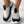 Zwart-witte sneakers met gebreid bovenwerk en gouden enkelbandjes, comfortabele sportschoenen voor dames, modieuze en ademende stijl.