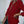 Vrouw in bordeauxrode blazer, casual chique stijl, met beige tas. Perfect voor mode, dameskleding, herfstoutfits, zakelijke casual look.