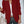 Vrouw in bordeauxrode blazer, witte blouse en jeans, met beige handtas. Stijlvolle zakelijke outfit, mode voor dames, herfstkleding.