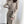 Elegante beige winterjurk met lange mouwen en ceintuur, ribbelpatroon, perfect voor stijlvolle wintermode. Dameskleding, modetrends, winterjurk.