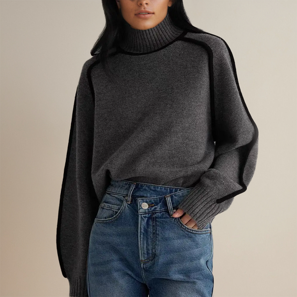 Vrouw in grijze coltrui en blauwe jeans, modieuze herfstkleding, casual stijl, comfortabele damesmode, trendy outfit voor koud weer.