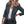 Vrouw in donkergrijs colbert, witte blouse en jeans, met blonde golvende haren. Stijlvolle zakelijke outfit, mode voor dames, casual chic look.