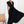 Elegante zwarte geplooide jurk met diepe V-hals, gedragen door model. Perfect voor avondkleding. Stijlvolle mode, chique design, tijdloze elegantie.