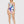 Vrouw in kleurrijk asymmetrisch badpak met vlinderprint, Desigual design, zomercollectie 2023, modetrend, strandkleding, damesmode.