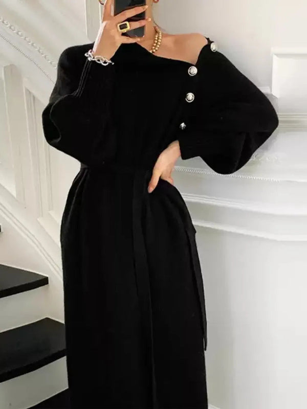 Elegante zwarte damesjurk met knopen, lange mouwen en ceintuur, perfect voor herfstmode. Stijlvolle outfit voor speciale gelegenheden.
