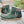 Groene leren enkellaarsjes met ritssluiting, bruine zool en geruite details. Comfortabele dameslaarzen, ideaal voor herfstmode en casual outfits.
