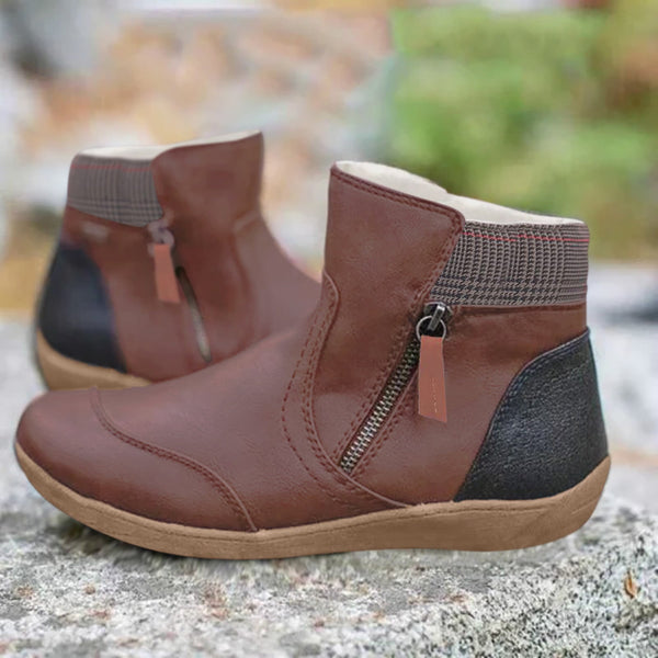 Bruine leren enkellaarsjes met ritssluiting, comfortabele zool en zwarte hiel, perfect voor herfstmode. Stijlvolle dameslaarzen voor dagelijks gebruik.
