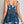 Vrouw in blauwe bloemen tankini met doorschijnende rug, zomerse strandkleding, plus size mode, comfortabele badmode, trendy zwemkleding.