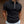 Zwarte polo met ritssluiting, gedragen door man, korte mouwen, casual stijl. Perfect voor modieuze herenkleding, comfortabele pasvorm.