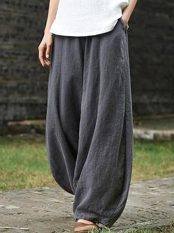 Grijze linnen harem broek voor dames, casual en comfortabel, ideaal voor zomer en lente. Stijlvolle wijde pasvorm met elastische tailleband.