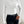 Vrouw draagt witte, lange mouwen top met ruches en zwarte broek. Stijlvolle outfit, moderne mode, casual chique look, perfect voor dagelijks gebruik.