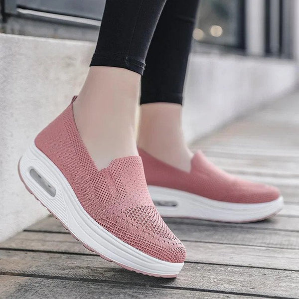Roze dames sneakers met luchtkussen zool, ademend mesh bovenwerk, comfortabele slip-on stijl, ideaal voor casual en sportieve outfits.