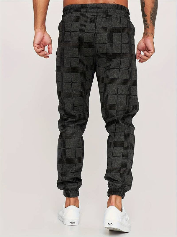 Grijze geruite joggingbroek voor heren, comfortabele pasvorm, casual streetwear, ideaal voor dagelijks gebruik, mode en stijlvol design.
