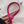 Roze leren riem met gouden gesp op witte stoffen achtergrond, stijlvolle modeaccessoire, trendy damesriem, close-up detailopname.