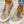 Canvas instappers met dierenprint, trendy ontwerp, beige en bruine tinten, witte zool, casual damesmode, perfect voor dagelijks gebruik.