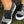 Zwarte canvas instappers met camouflage- en dierenprint, witte zool. Trendy damesschoenen voor casual stijl. Comfortabele slip-on sneakers.