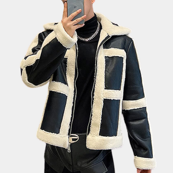 Zwart-witte shearling jas voor heren, modieus ontwerp met rits en contrasterende panelen, ideaal voor wintermode en stijlvolle herenkleding.