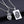 Zilveren anatomisch hartketting en hanger set op zwarte achtergrond, uniek sieraad, moderne stijl, perfect cadeau voor liefhebbers van sieraden.