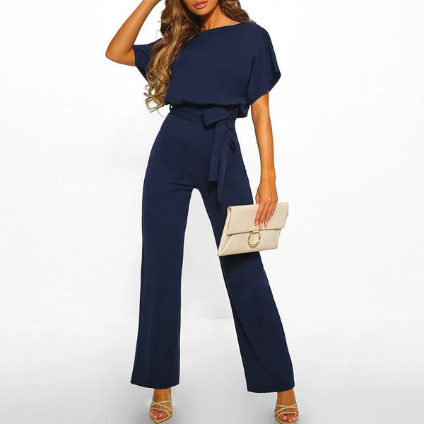 Elegante dames jumpsuit, donkerblauw, ronde hals, wijde pijpen, ceintuur, geschikt voor zomerfeesten. Stijlvolle en modieuze outfit.