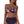 Vrouw in bloemenbikini met hoge taille, donkerblauw met roze bloemenprint, strandmode, zomerkleding, stijlvolle badkleding.