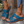 Blauwe leren sandalen voor dames met open teen en verstelbare bandjes, gedragen met jeans. Comfortabele zomerschoenen, perfect voor casual outfits.