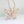 Gouden vlinderhanger met roze edelstenen en kristallen op een ketting, sieradenaccessoire, elegant ontwerp, perfect cadeau voor dames.