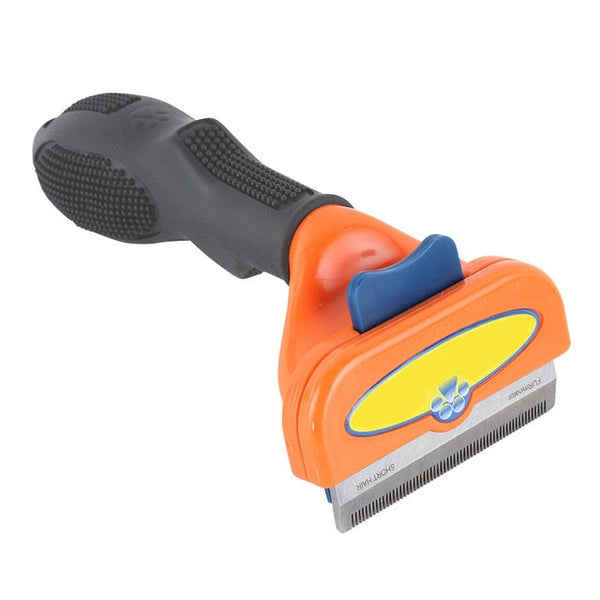 Oranje en zwarte hondenborstel met ergonomische handgreep en metalen kam, ideaal voor het verwijderen van losse haren en het verzorgen van de vacht.