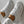Witte sneakers met bloemenpatroon en gouden enkelband, gedragen door een persoon in witte broek. Stijlvolle damesmode, trendy schoenen.