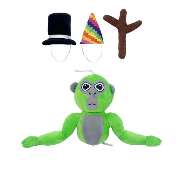 Groene gorilla knuffel met verwisselbare hoeden: hoge hoed, regenboog feesthoed en bruine tak. Perfect speelgoed voor kinderen.