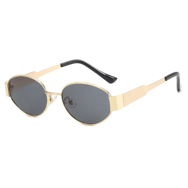 Gouden zonnebril met ovale, donkere glazen en zwarte pootjes. Stijlvol accessoire voor heren en dames, ideaal voor modieuze zomerdagen.